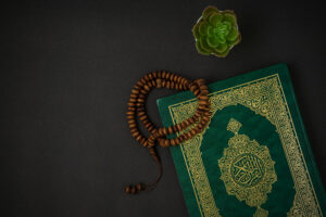 Holy al quran with written arabic calligraphy meaning al quran 300x200